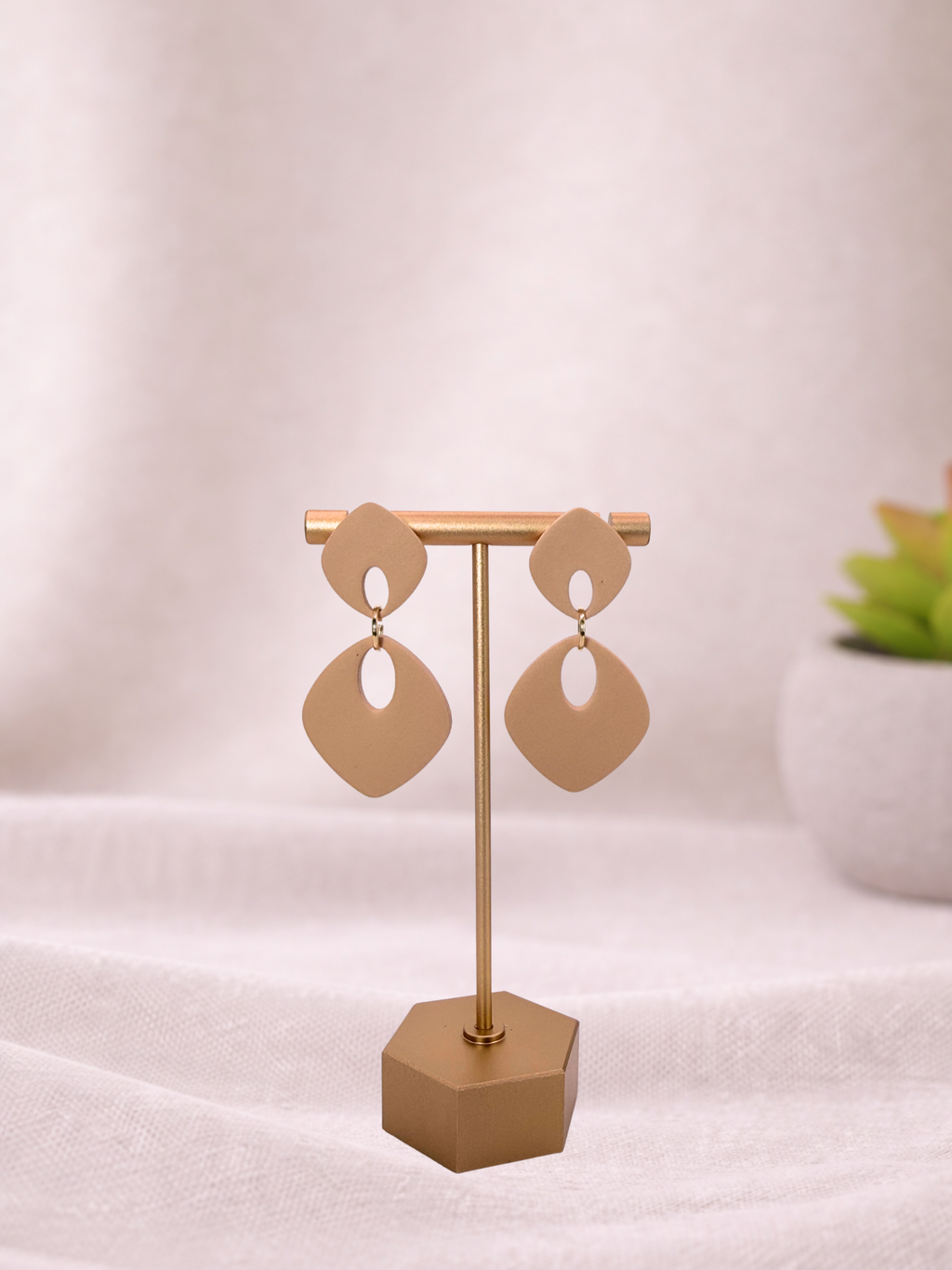 Fable Clay Co ISLA soft drop statement earrings with colorful clay design and gold hooks, hanging against a neutral background.