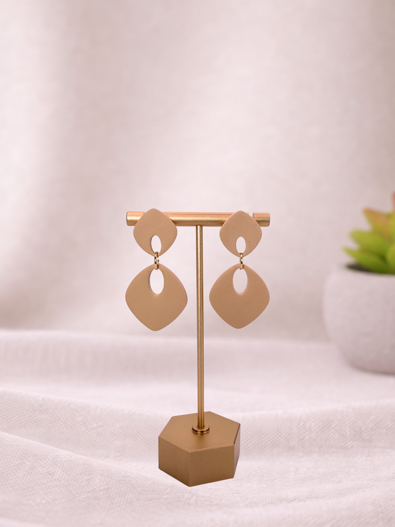 Fable Clay Co ISLA soft drop statement earrings with colorful clay design and gold hooks, hanging against a neutral background.