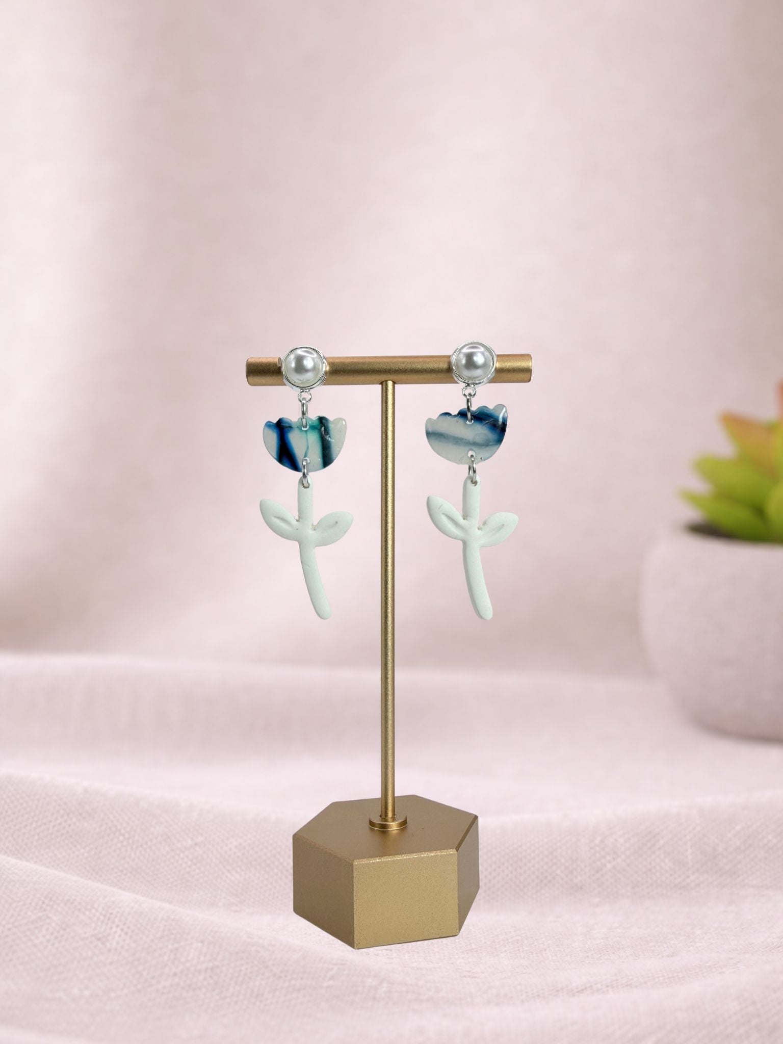Blue Tulip II ceramic vase by Fable Clay Co, featuring a vibrant blue tulip design with a sleek, modern shape.