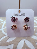 Fable Clay Co floral arrangement with colorful ceramic flowers in a decorative vase, showcasing vibrant and detailed floral art.