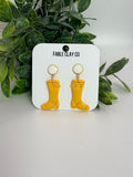 Fable Clay Co rain boots in vibrant yellow, waterproof footwear with sturdy soles and stylish design for rainy weather.