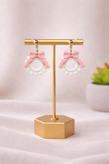Fable Clay Co Fancy Sculpted Bow Wreath earrings, gold dangle studs with feminine statement design and lightweight clay material.
