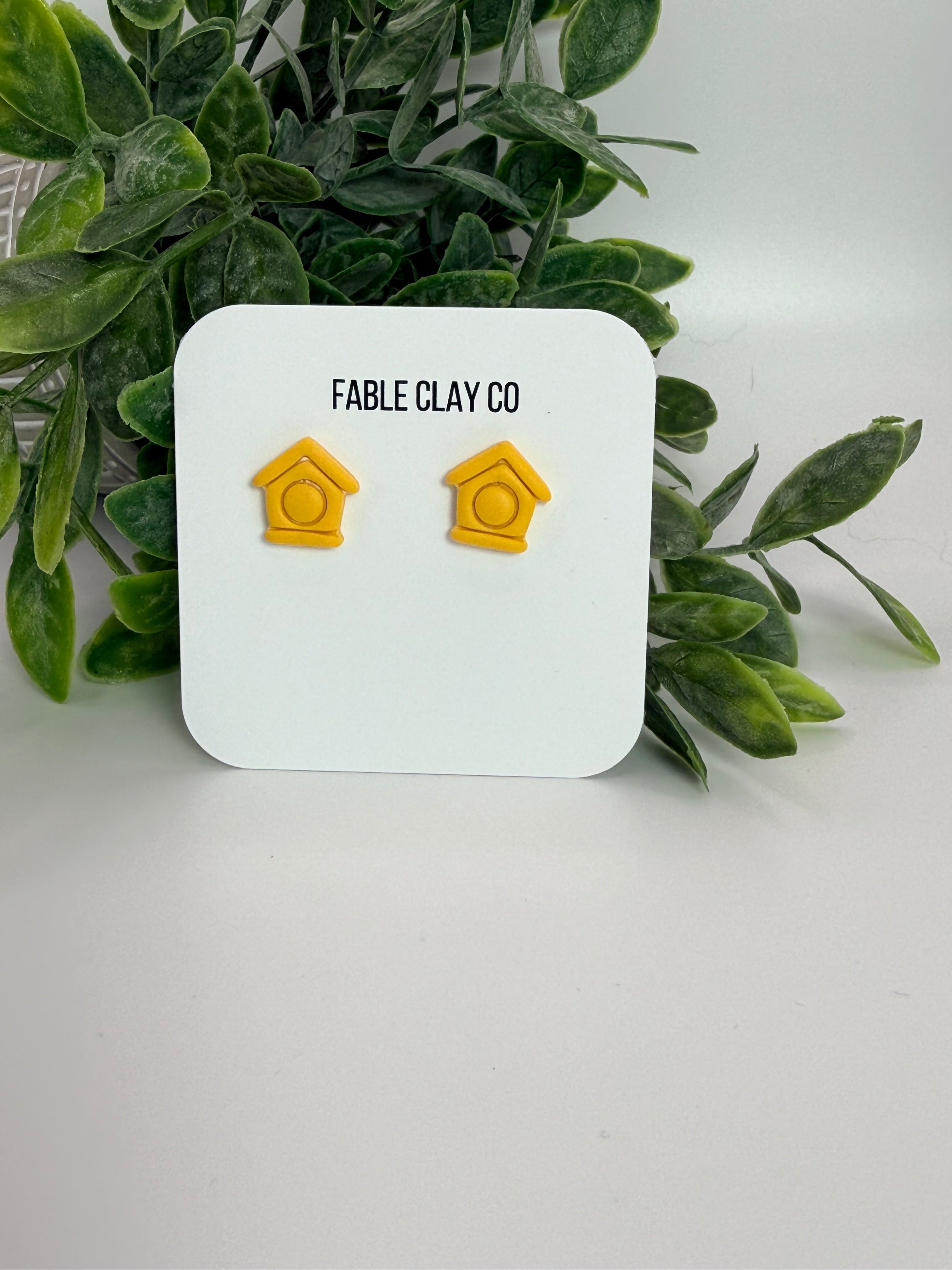 Fable Clay Co bird house with a rustic design, featuring a small entrance hole and natural clay finish for outdoor bird nesting.
