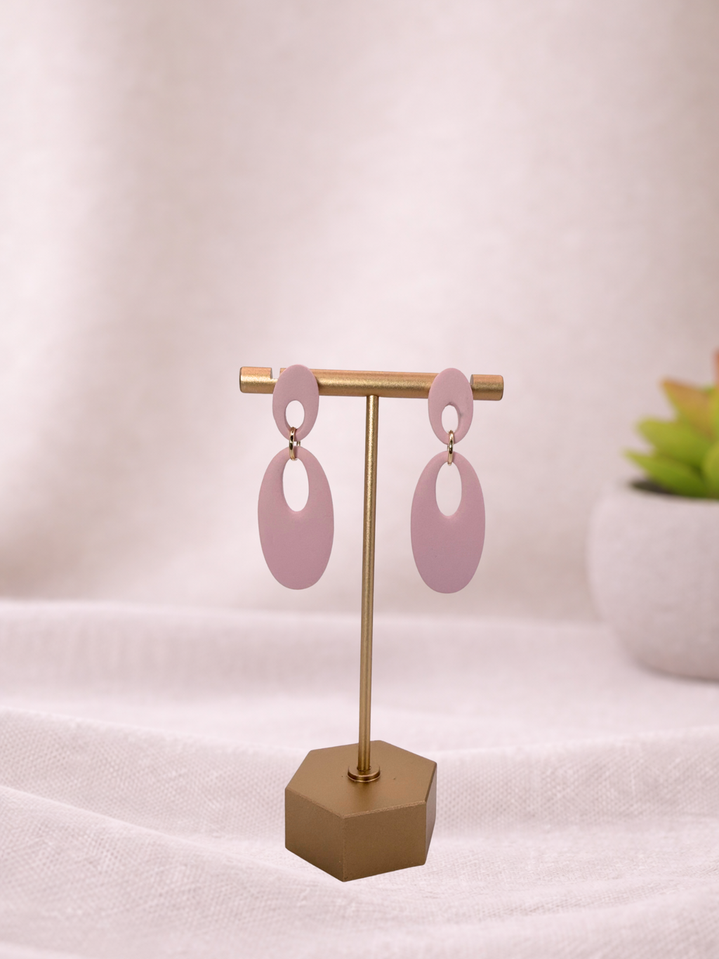Fable Clay Co Reese minimal oval drop earrings with smooth, oval-shaped clay drops hanging from gold-tone hooks.