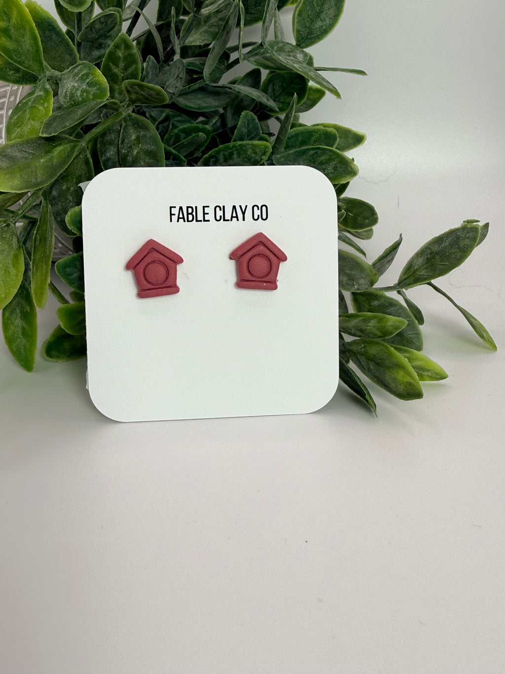 Fable Clay Co bird house with rustic wooden design, small entrance hole, and natural finish for garden or yard decoration.