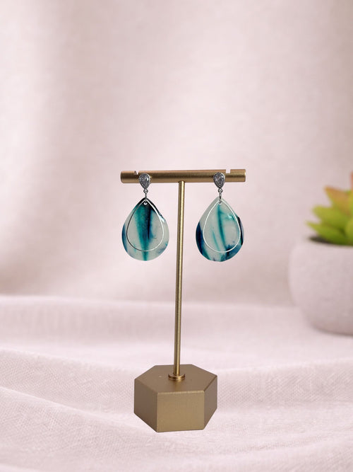 Blue Current II ceramic vase by Fable Clay Co, featuring a textured blue glaze and modern cylindrical shape.