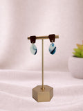 Blue Drift I ceramic sculpture by Fable Clay Co featuring a smooth, abstract blue clay form on a wooden base.