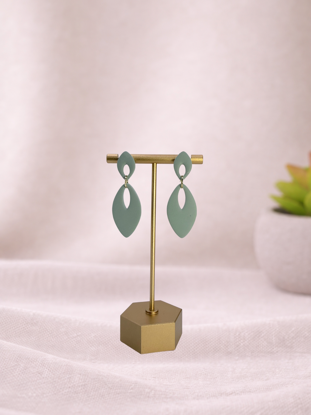 Fable Clay Co Eloise Spring Vault ceramic vase with a soft pastel green glaze and textured finish on a white background