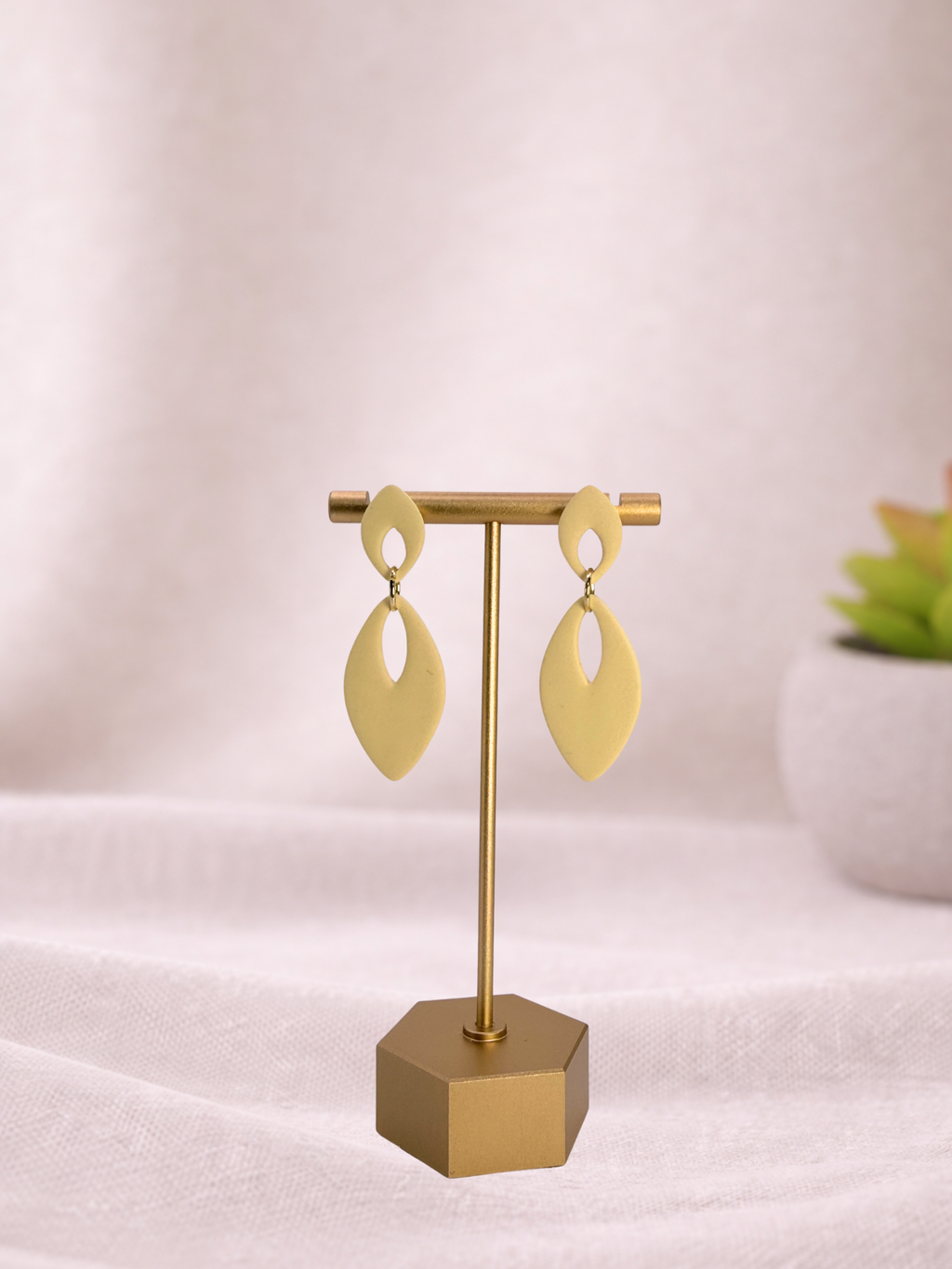 Fable Clay Co Eloise Spring Vault ceramic vase with textured surface and pastel green finish on a white background.