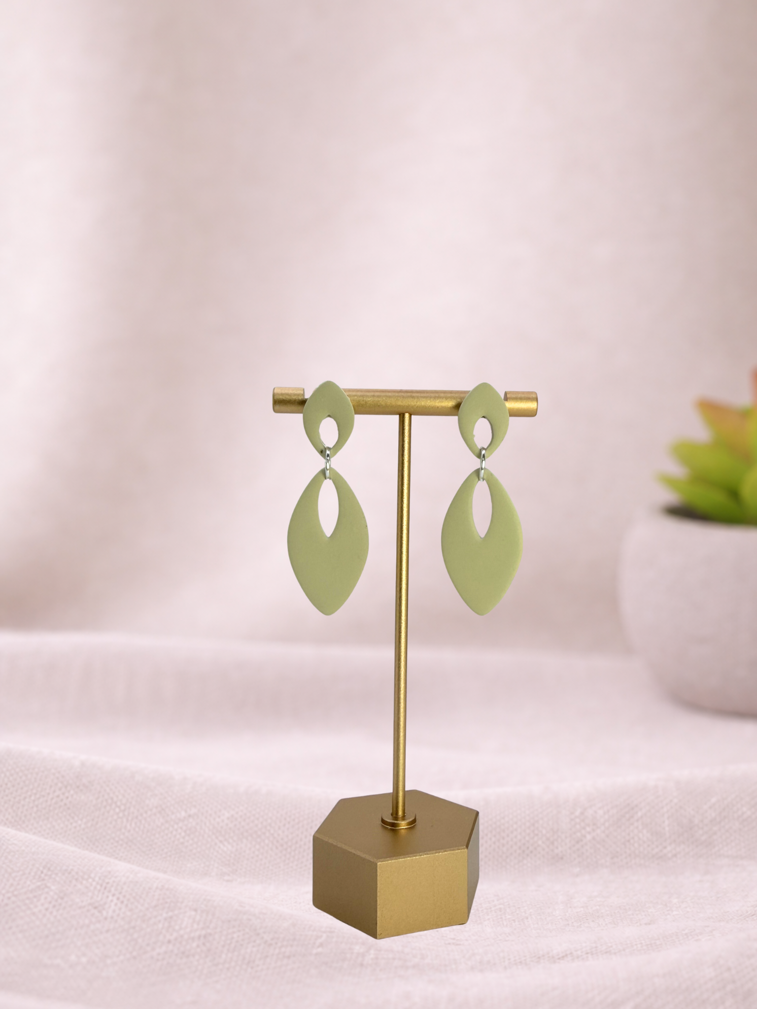 Fable Clay Co Eloise Spring Vault ceramic vase with a soft pastel green glaze and rounded shape, displayed on a neutral background.