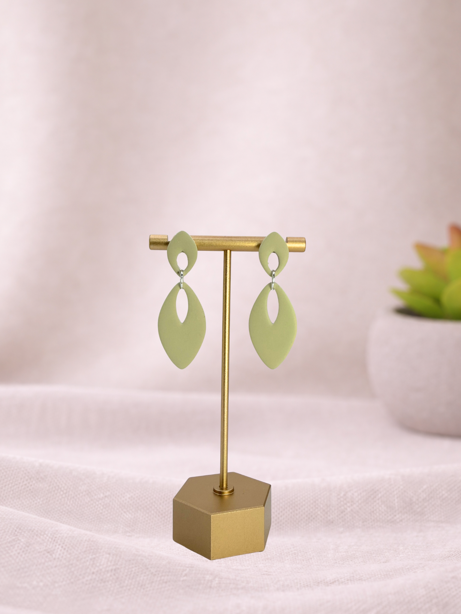 Fable Clay Co Eloise Spring Vault ceramic planter with rounded shape and pastel green glaze, showcasing a smooth, glossy finish.