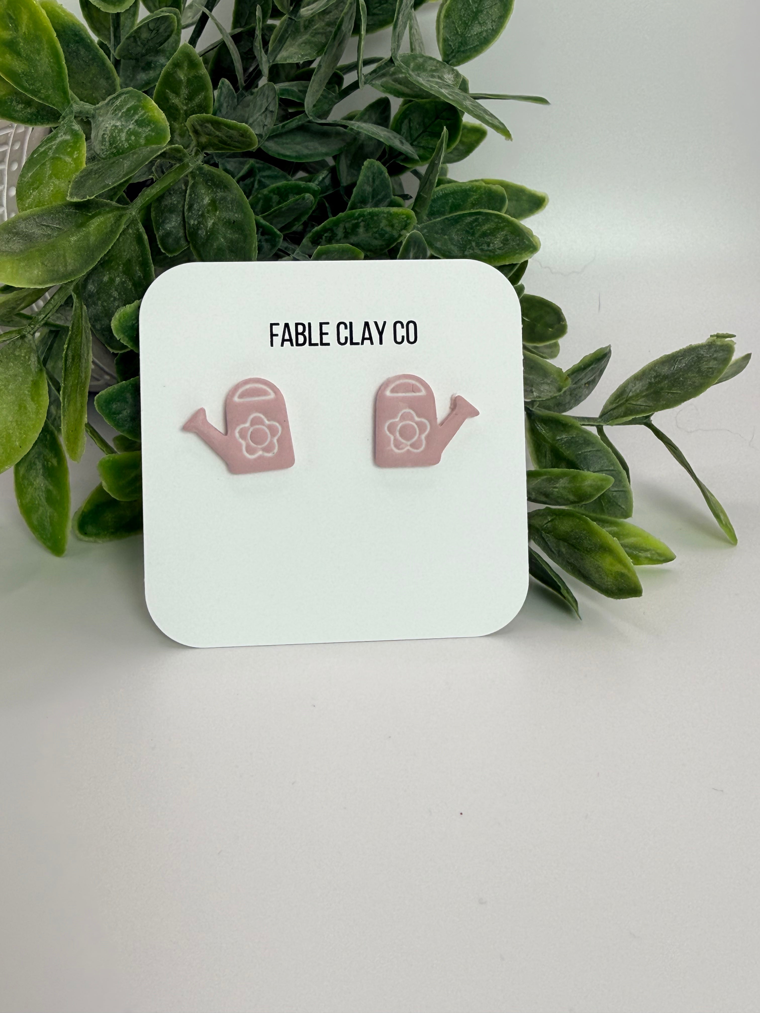 Fable Clay Co water can with a sleek, minimalist design, featuring a metal spout and handle for easy watering.