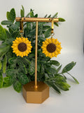Fable Clay Co sunflower ceramic sculpture with detailed yellow petals and green stem on a neutral background